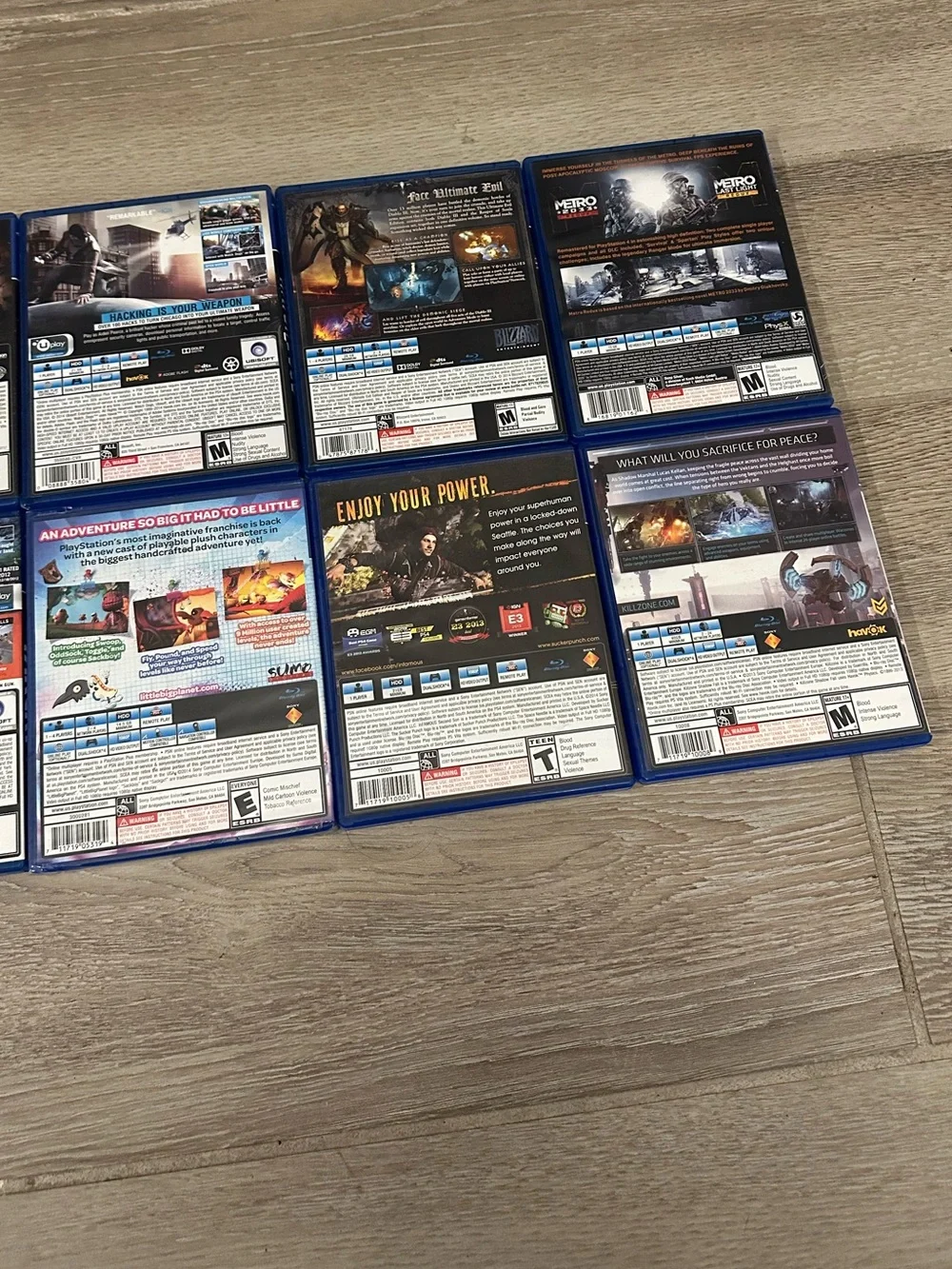 PlayStation 4 Video Games Lot (8) (Watch Dogs, Metro Redux, Batman, Far Cry 4)